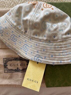 Gucci Beige Bucket Hat with Light Blue and Orange Accents